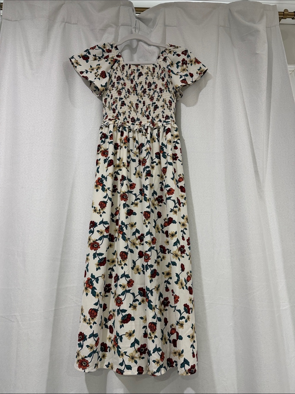 Ivy City Co Cream Floral Smocked jumpsuit with Red & Teal Accents